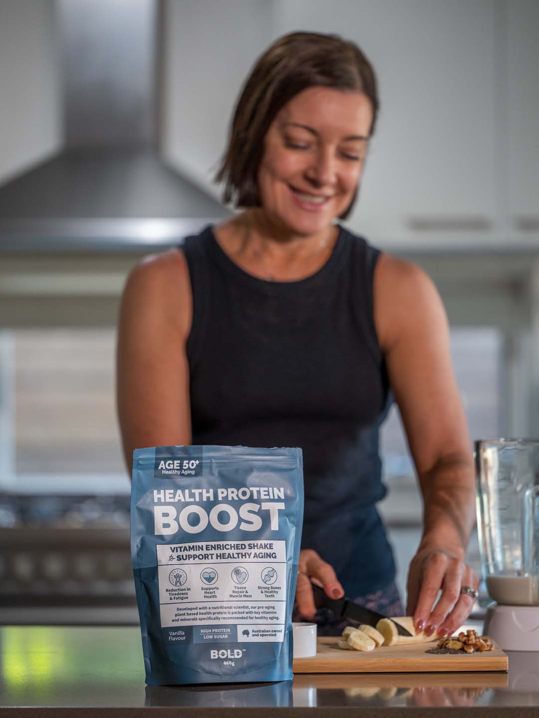 Woman in her 50s preparing food in her kitchen