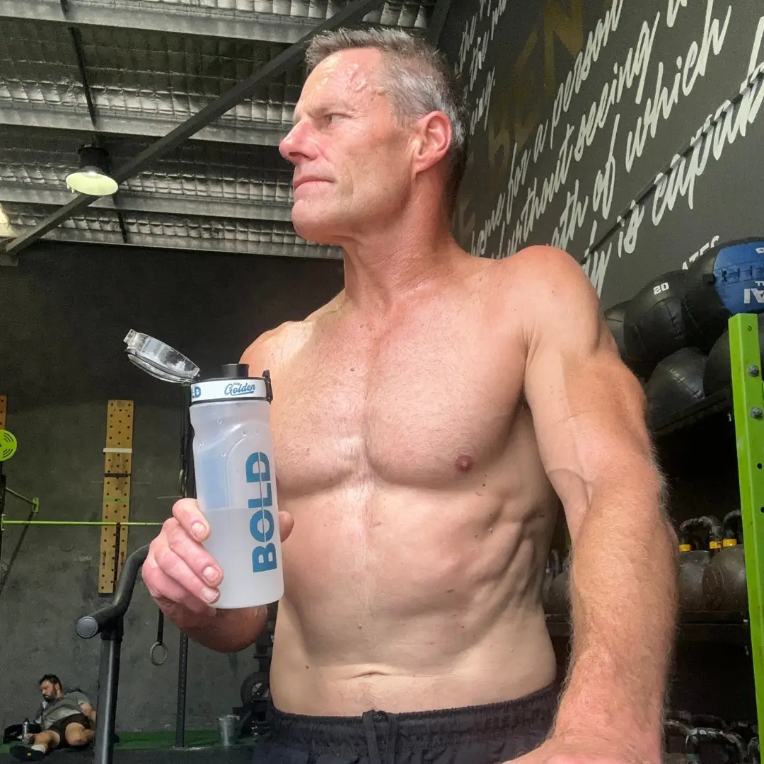 Athlete in gym with BOLD shaker bottle